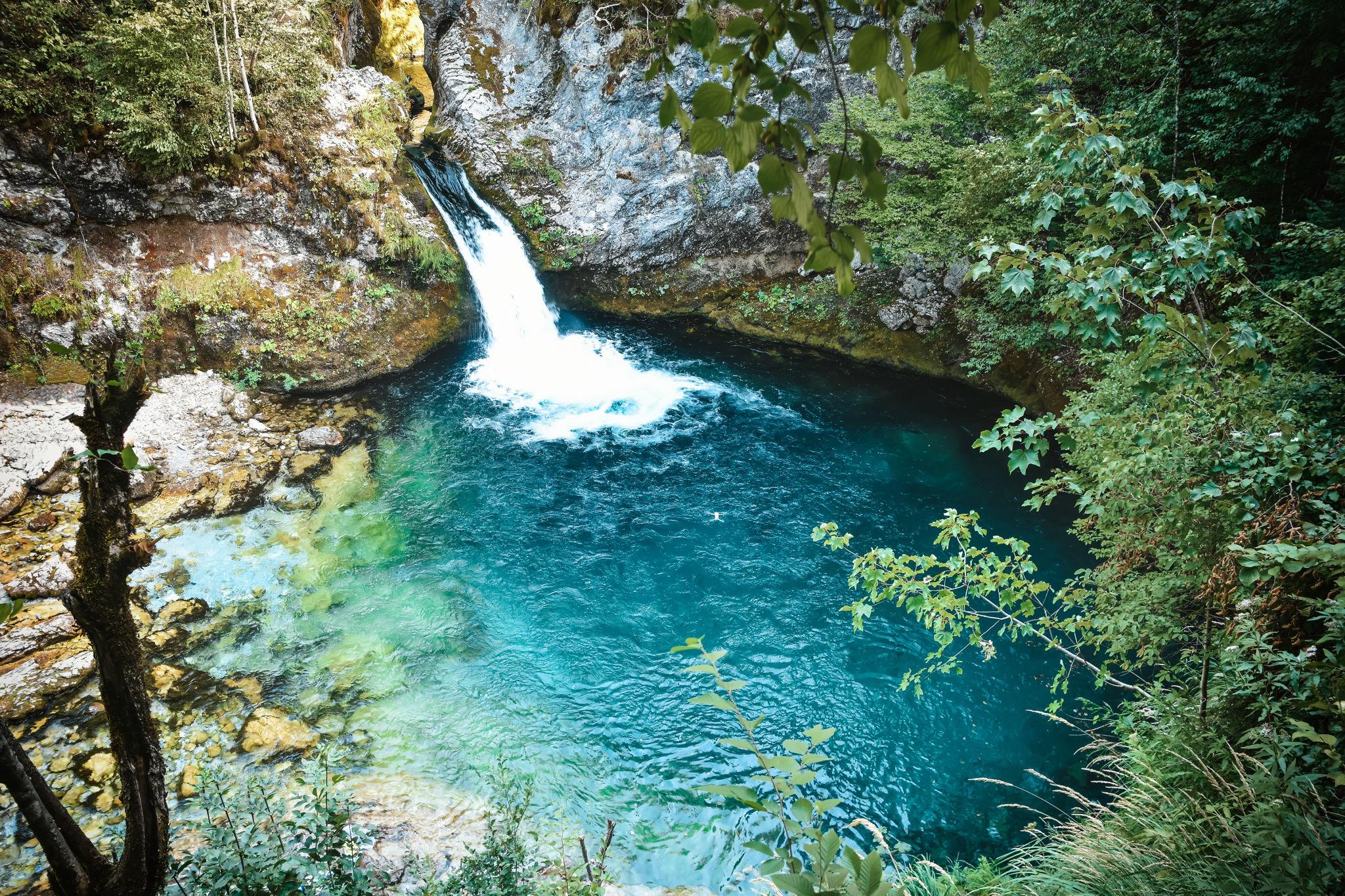 Turquoise waterfall pool in the Albanian Alps — the Blue Eye of Theth or Grunas gorge