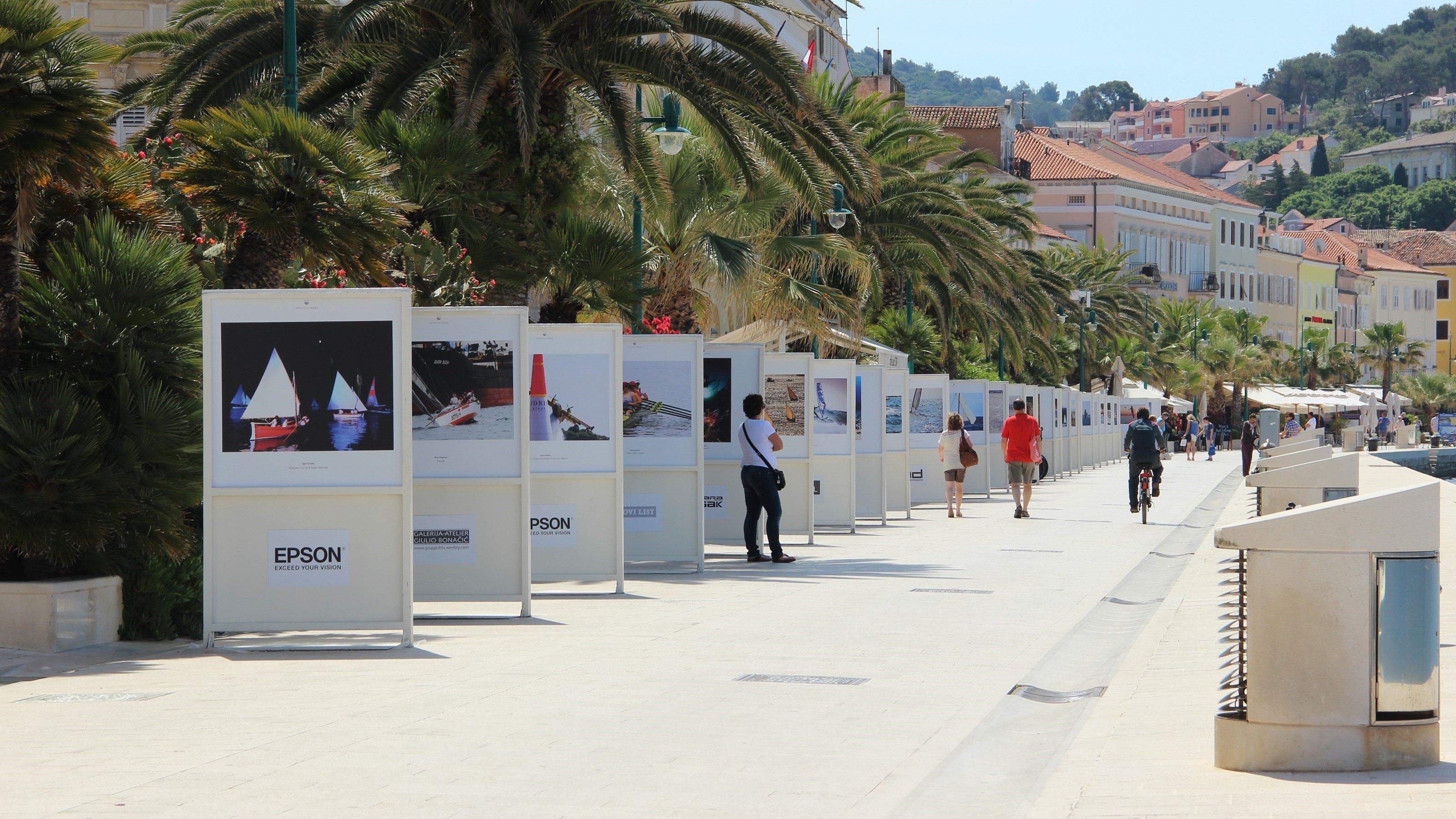 Mali Lošinj promenade with palm trees and Habsburg-era facades